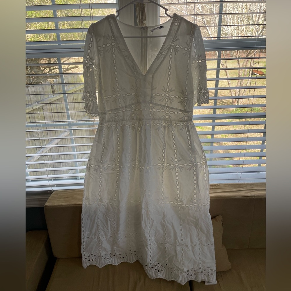 White dress. Never worn. Beautiful stitching design on dress.